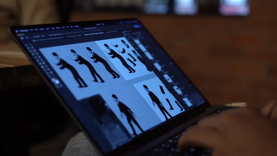 A laptop screen showing a line of figures from the Runway shoot